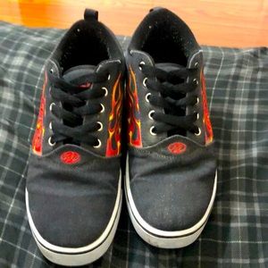 Heelys, comes with the wheels, covers, and hook to pull out the wheels. / size 8